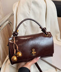 Brown Bag with Gold Charm