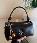 Black Bag with Gold Charm