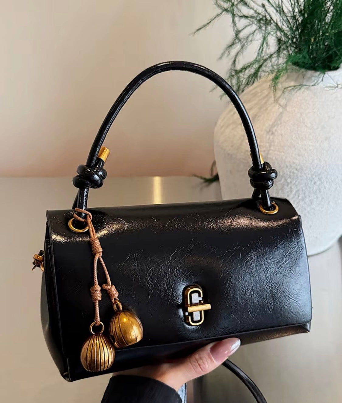 Black Bag with Gold Charm
